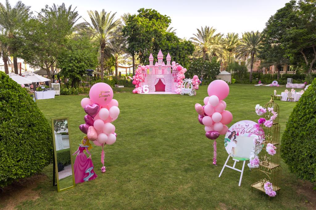 Dubai event organisers setting up open garden birthday decor - Game Booths